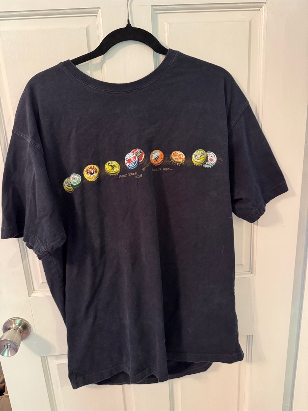 Black Graphic Short Sleeve Tee with Bottle Cap Design